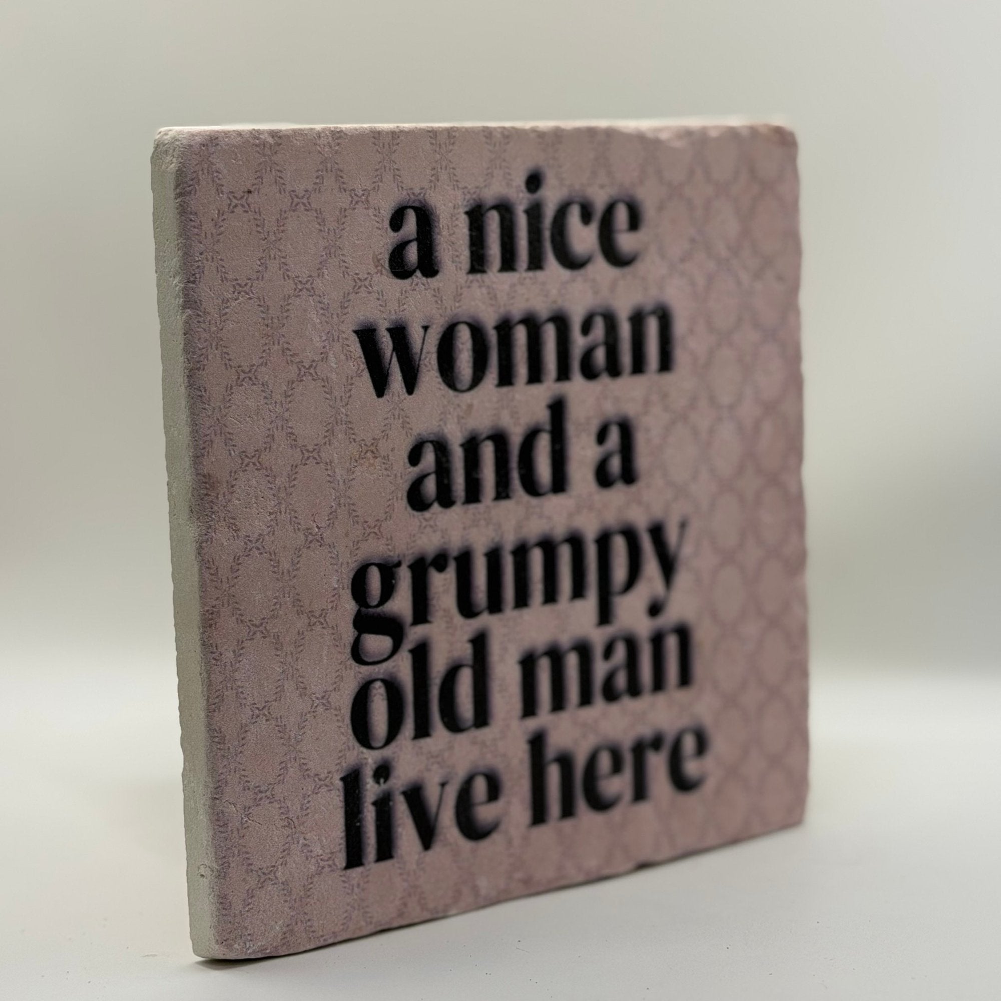 A Nice Woman And A Grumpy Old Man Live Here Natural Travertine Stone Hotpad artwork