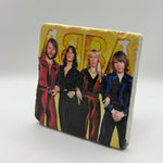 Abba logo and artwork printed on square travertine stone coaster