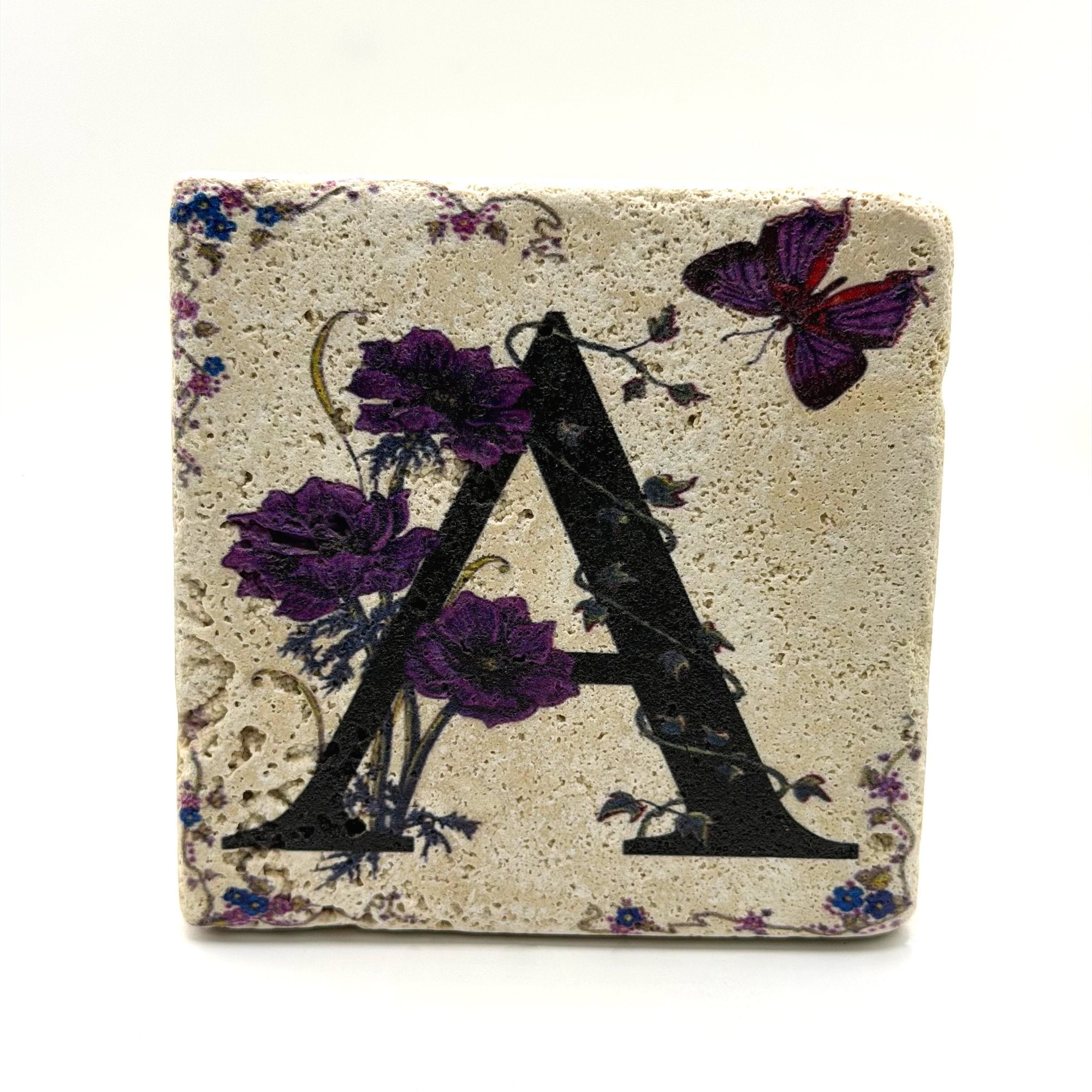 Alphabet letter A design printed on a natural stone coaster
