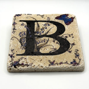 Alphabet letter B design printed on a natural stone coaster