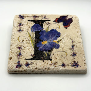 Alphabet letter I design printed on a natural stone coaster