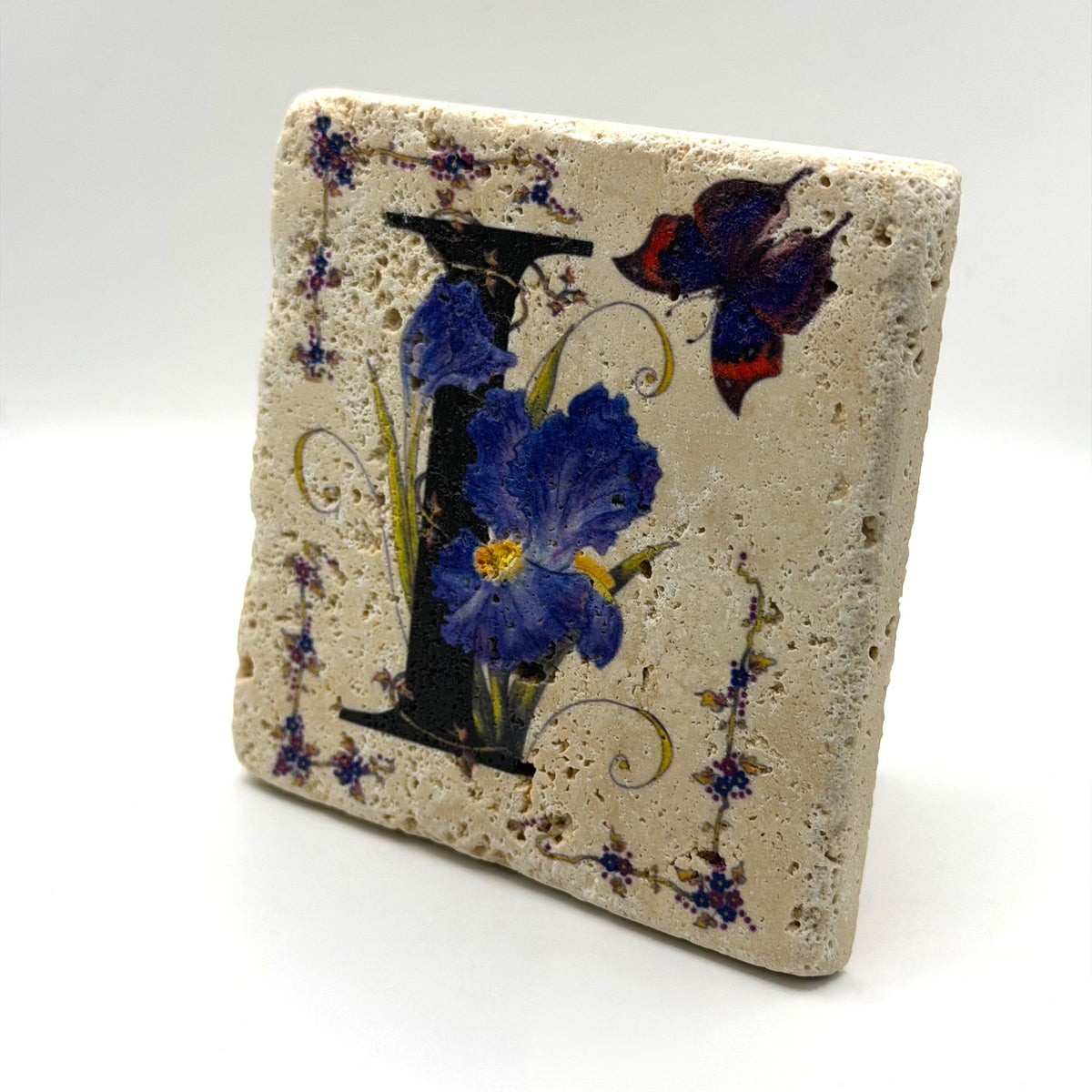 Alphabet letter I design printed on a natural stone coaster