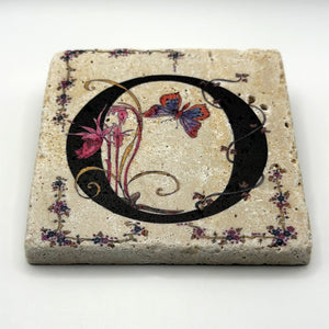 Alphabet letter O design printed on a natural stone coaster