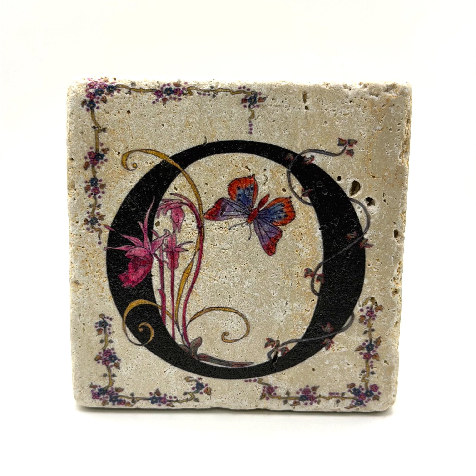 Alphabet letter O design printed on a natural stone coaster