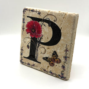 Alphabet letter P design printed on a natural stone coaster