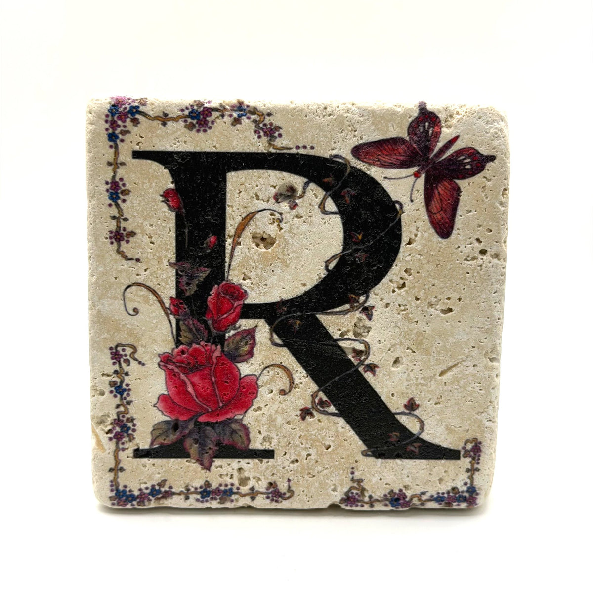 Alphabet letter R design printed on a natural stone coaster