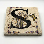 Alphabet letter S design printed on a natural stone coaster