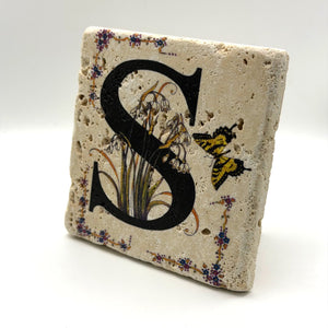 Alphabet letter S design printed on a natural stone coaster