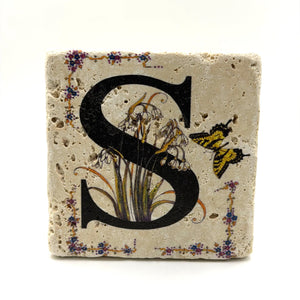 Alphabet letter S design printed on a natural stone coaster