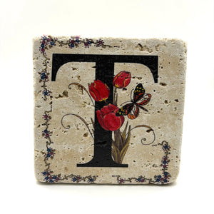 Alphabet letter T design printed on a natural stone coaster
