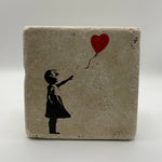 Banksy's iconic balloon artwork printed on square travertine stone coaster