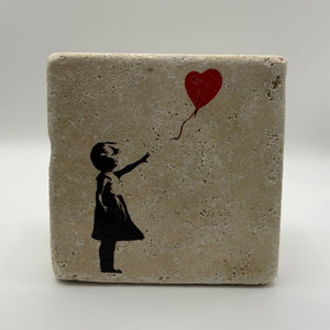 Banksy's iconic balloon artwork printed on square travertine stone coaster