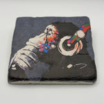 Banksy's Dj Monkey artwork printed on square travertine stone coaster