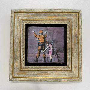 Variant Mapping v4 | banksy-girl-frisking-soldier-natural-stone-coaster | with Gold Frame | sha256:af8a8ffe7fc6
