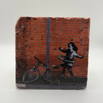 Banksy's Hula Hoop Girl artwork printed on square travertine stone coaster