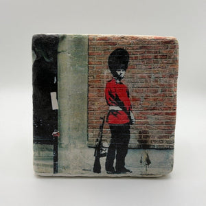 Banksy Pissing Guard artwork printed on square travertine stone coaster