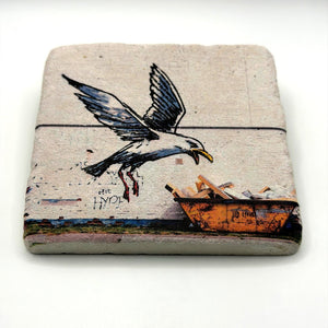 Banksy's Swooping Seagull artwork printed on square travertine stone coaster