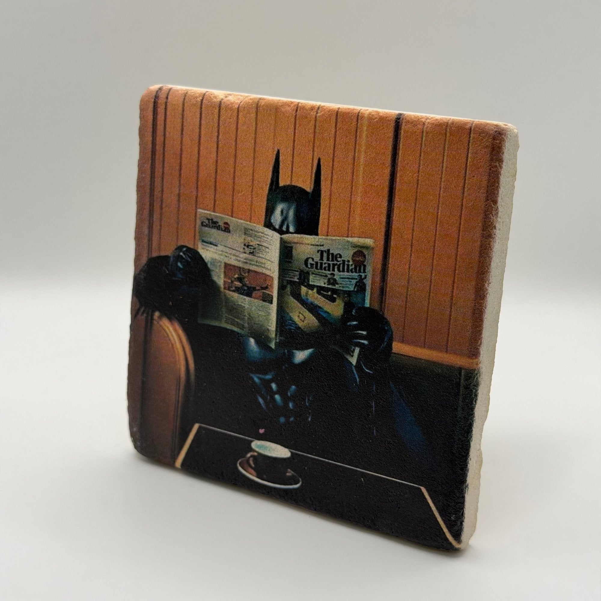 Batman logo artwork printed on square travertine stone coaster