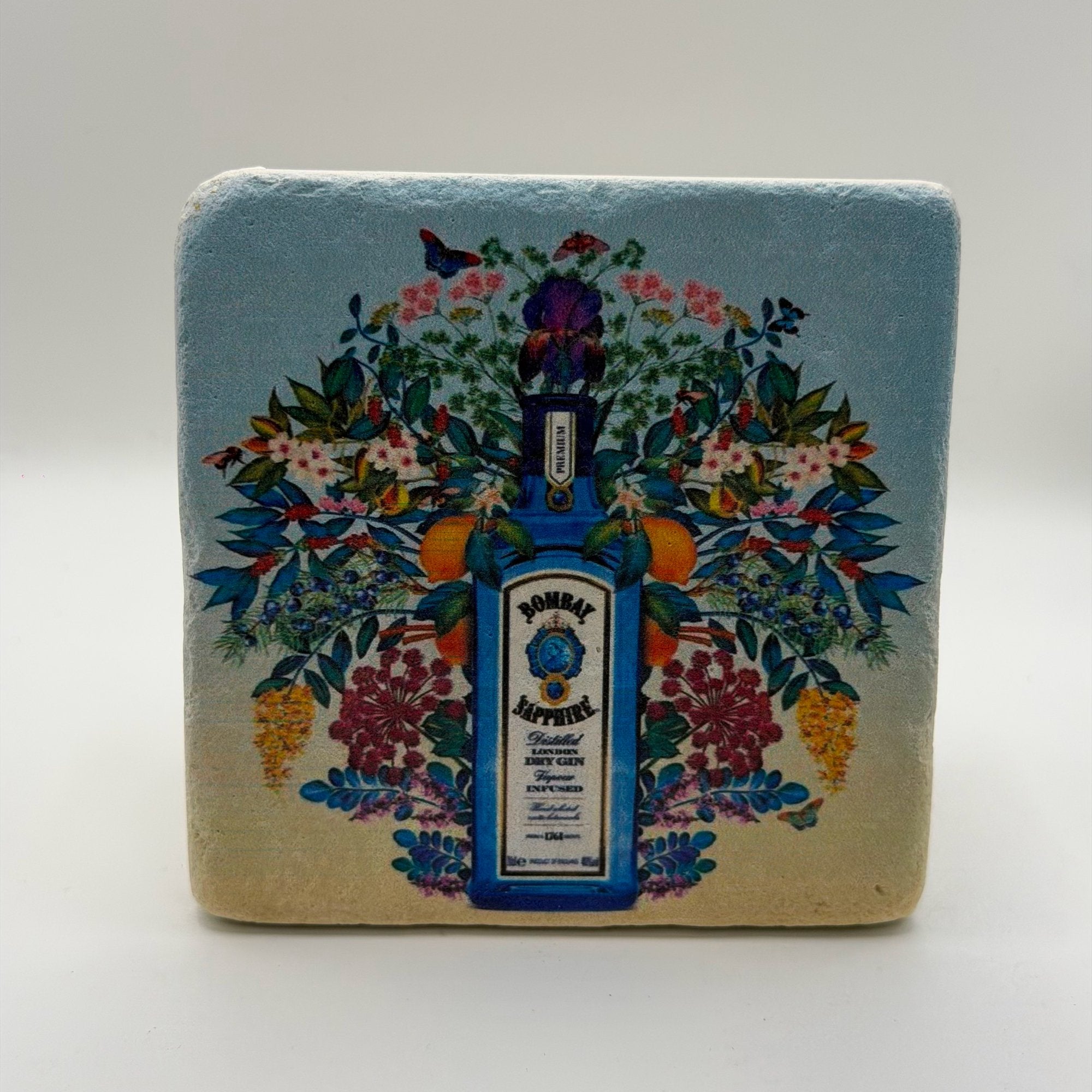 Bombay Sapphire logo printed on square natural travertine stone coaster