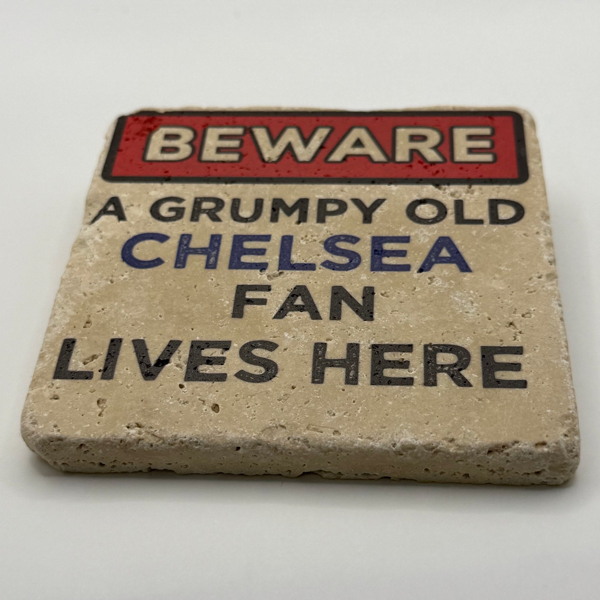 Grumpy old Chelsea fan artwork printed on square travertine stone coaster