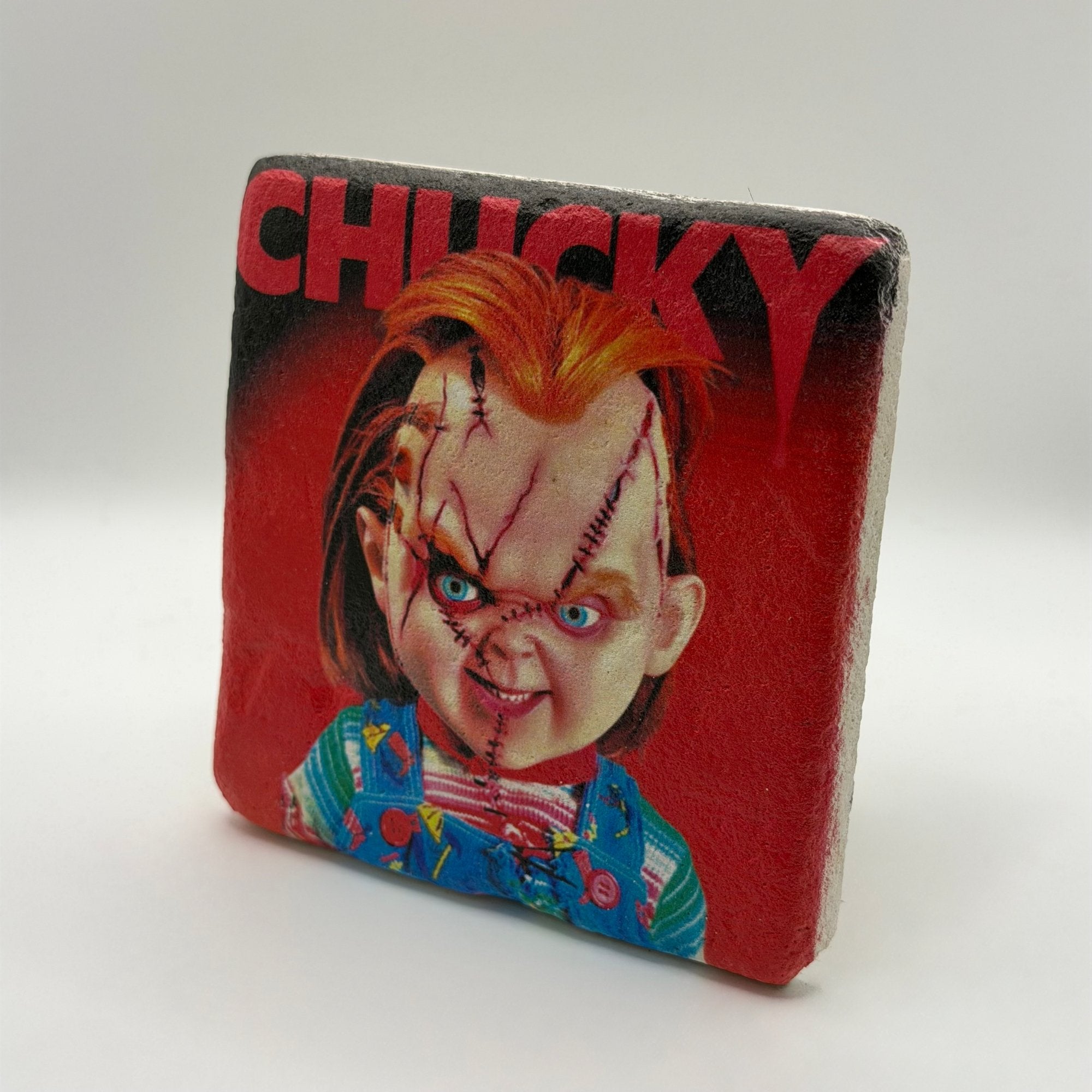 Chucky artwork printed on square travertine stone coaster