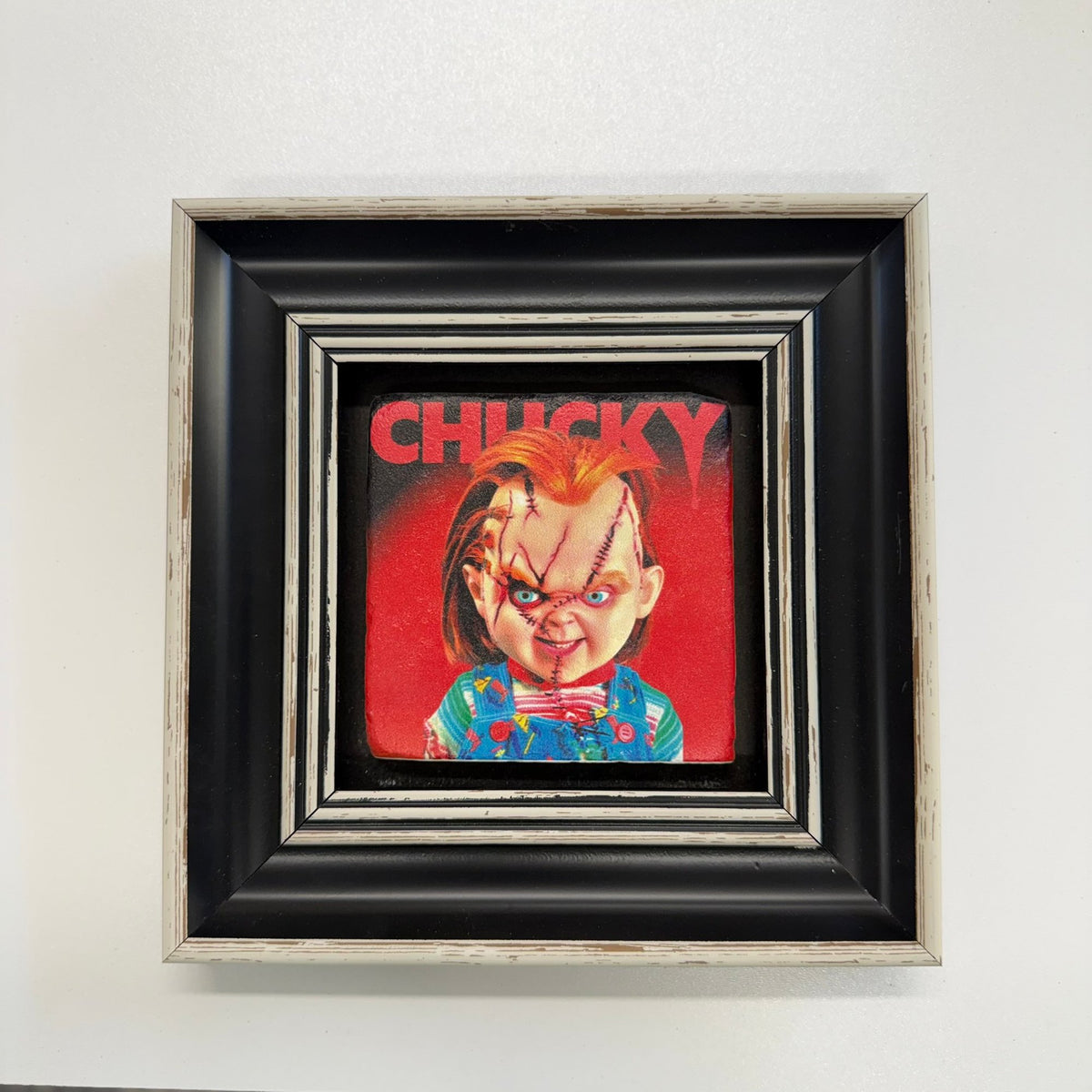 Variant Mapping v4 | chucky-natural-travertine-stone-coaster | with Black Frame | sha256:9d673e1f760f