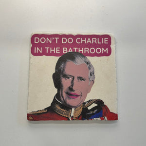 Dont Do Charlie In The Bathroom Natural Travertine Stone Hotpad artwork