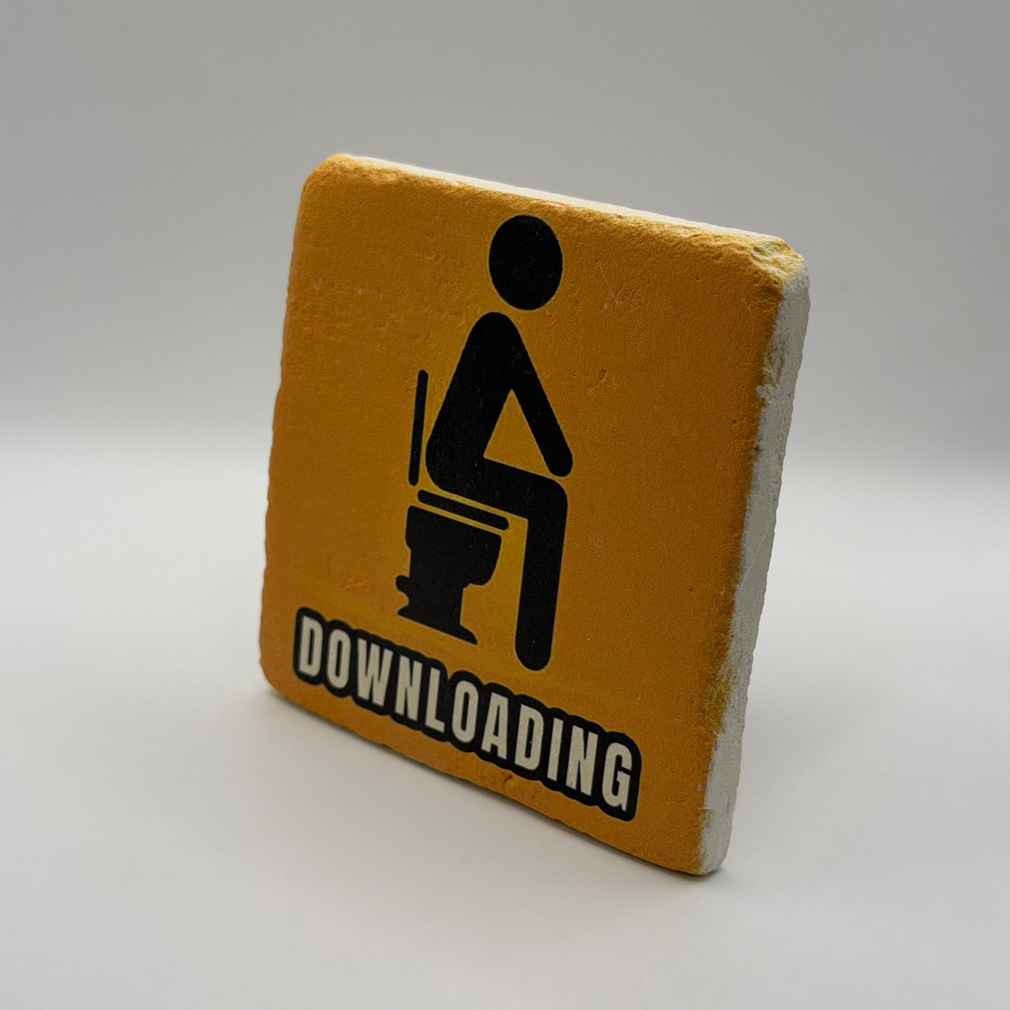 Funny toilet-themed quote printed on square travertine stone coaster