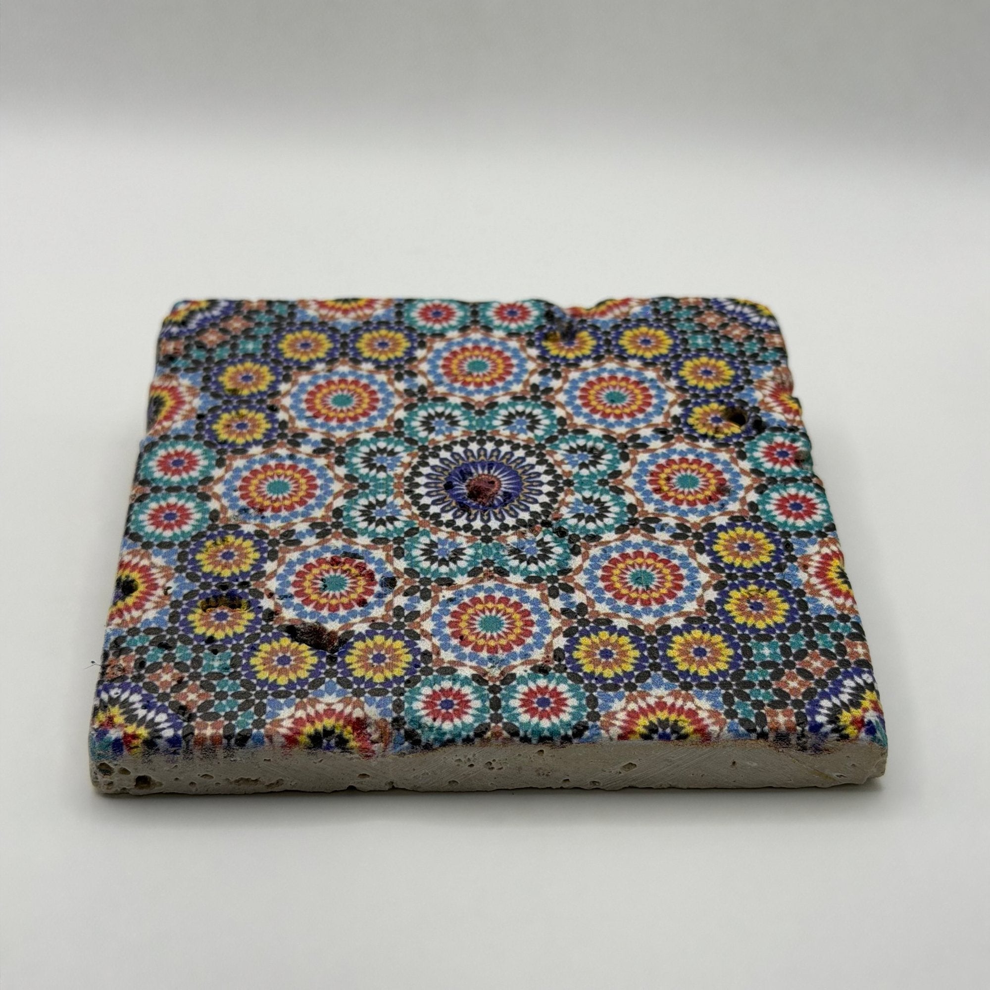 Ethnics pattern number 03 printed on a natural travertine stone coaster