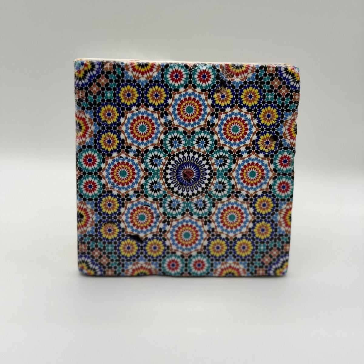 Ethnics pattern number 03 printed on a natural travertine stone coaster