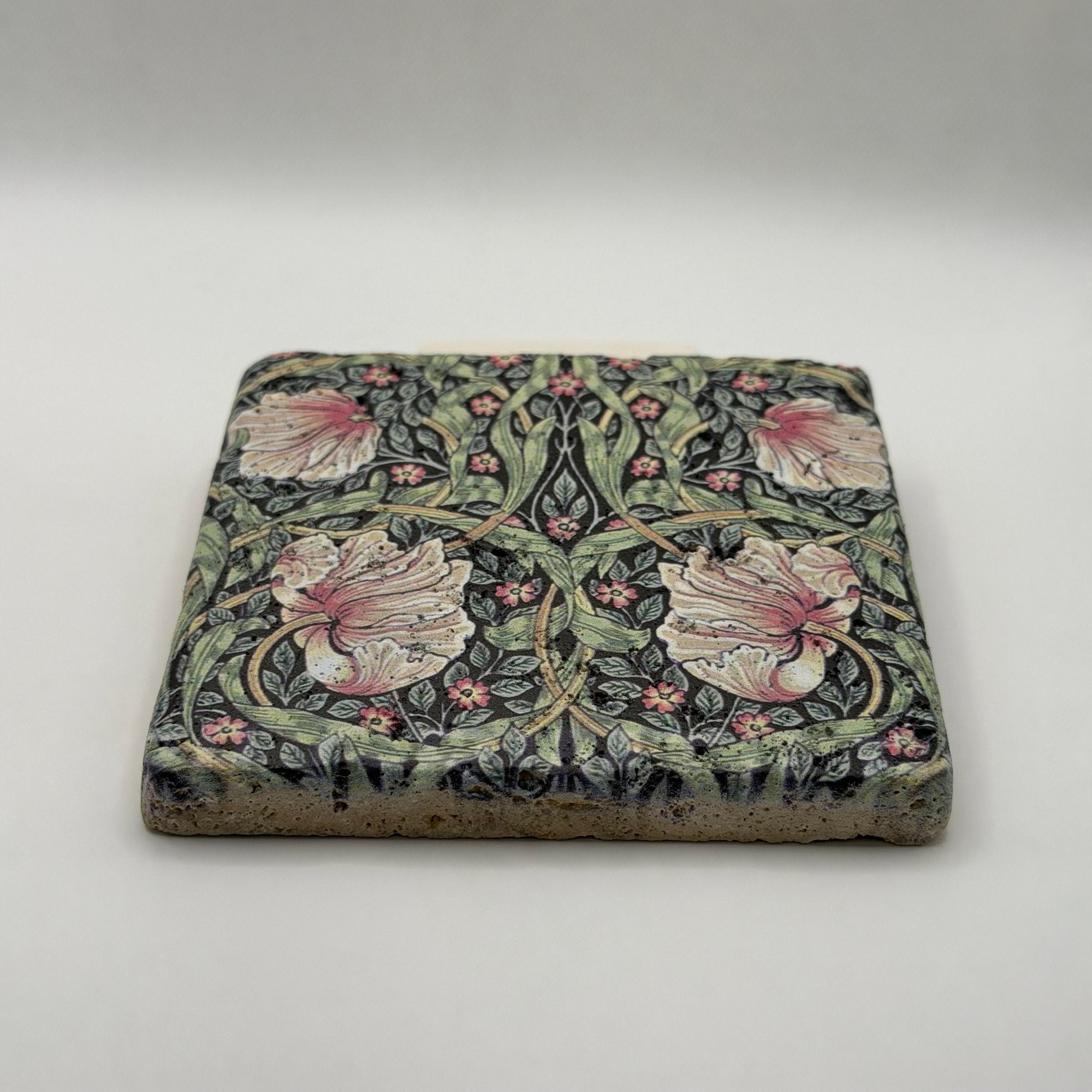 Ethnics pattern number 09 printed on a natural travertine stone coaster