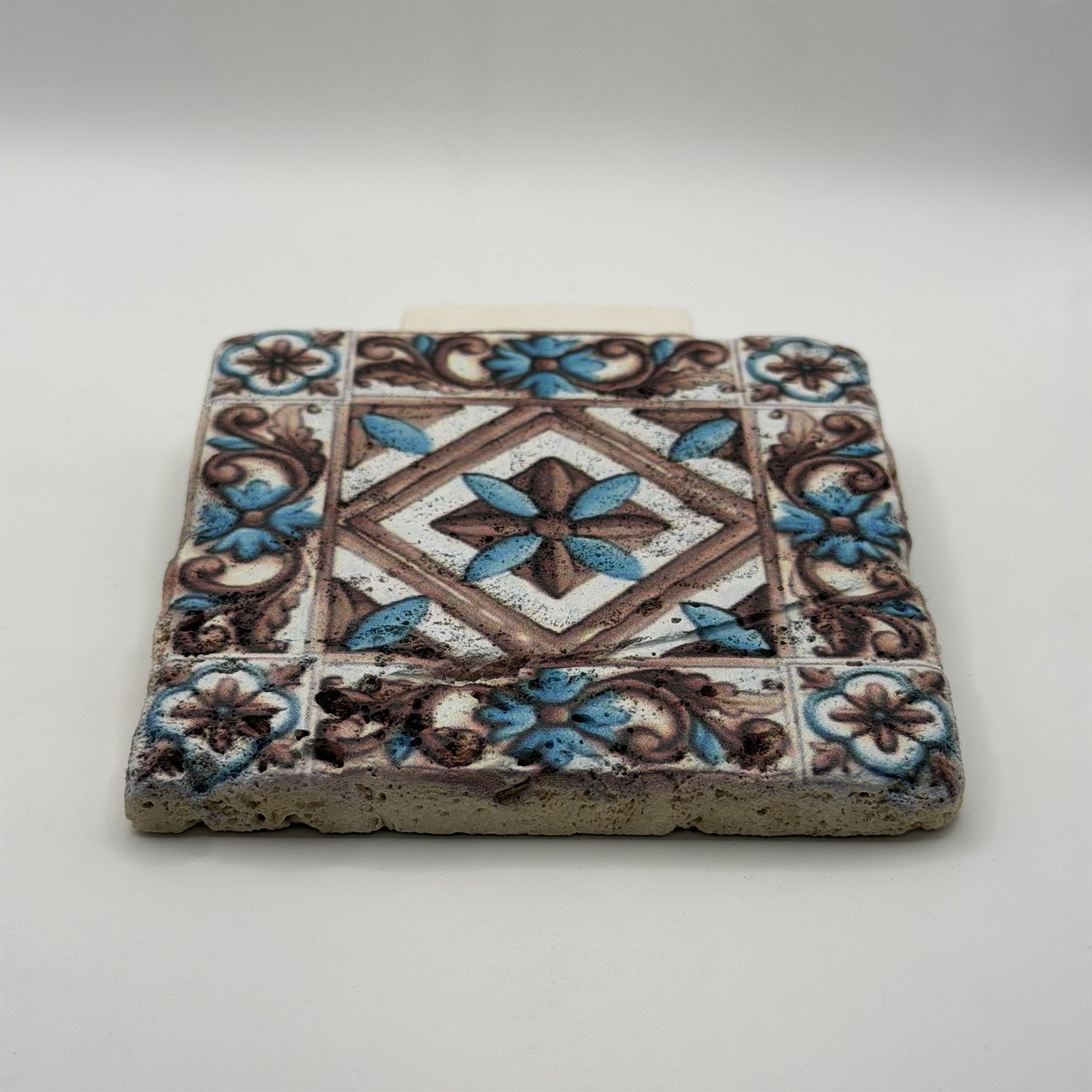 Ethnics pattern number 11 printed on a natural travertine stone coaster