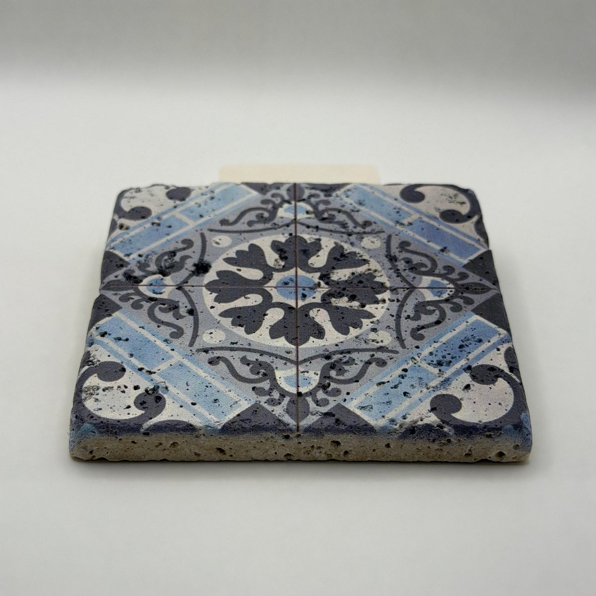 Ethnics pattern number 13 printed on a natural travertine stone coaster