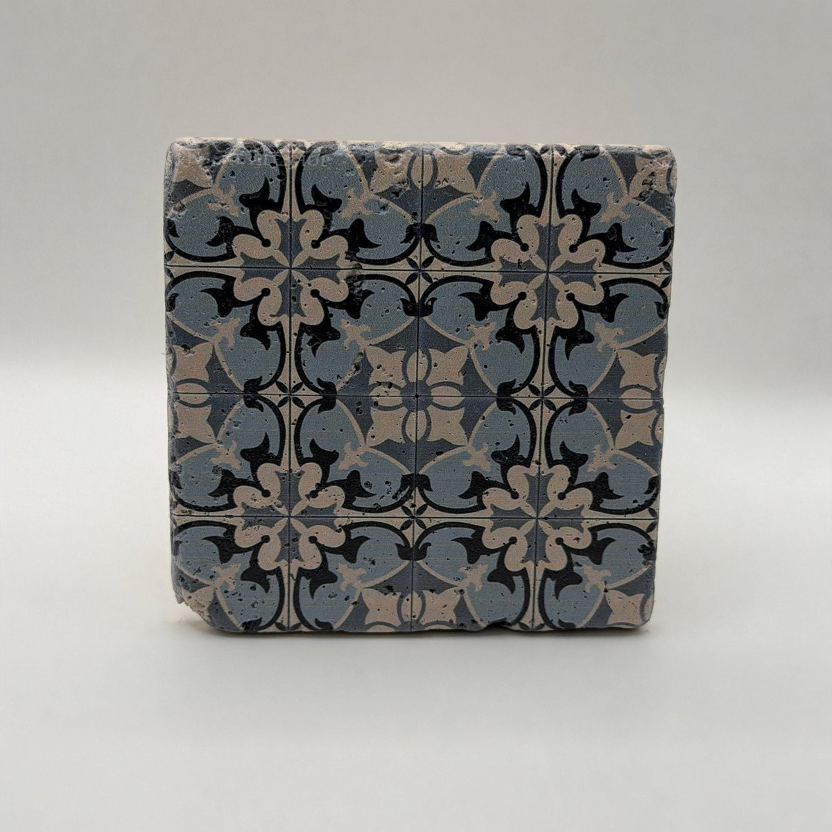 Ethnics pattern number 14 printed on a natural travertine stone coaster