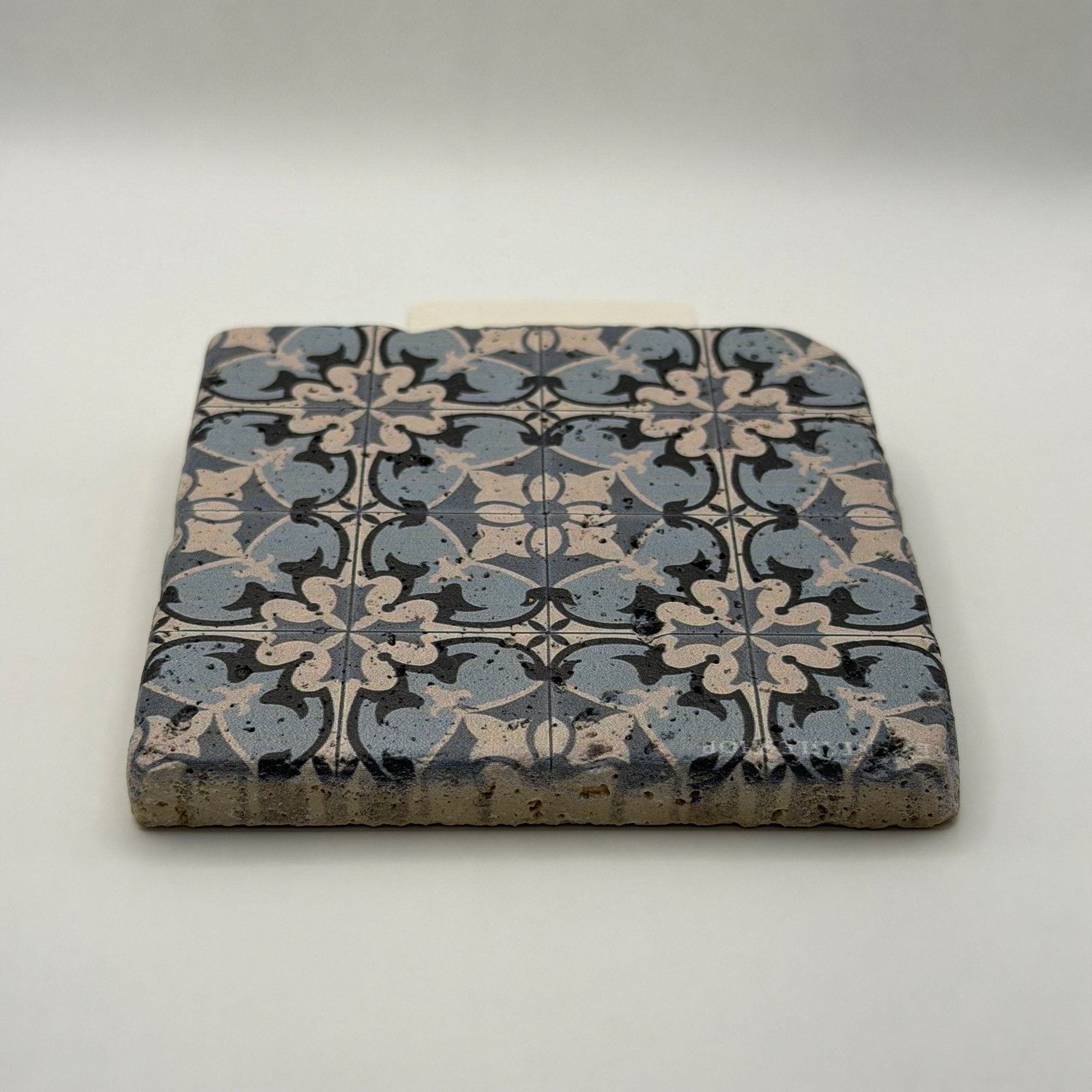Ethnics pattern number 14 printed on a natural travertine stone coaster