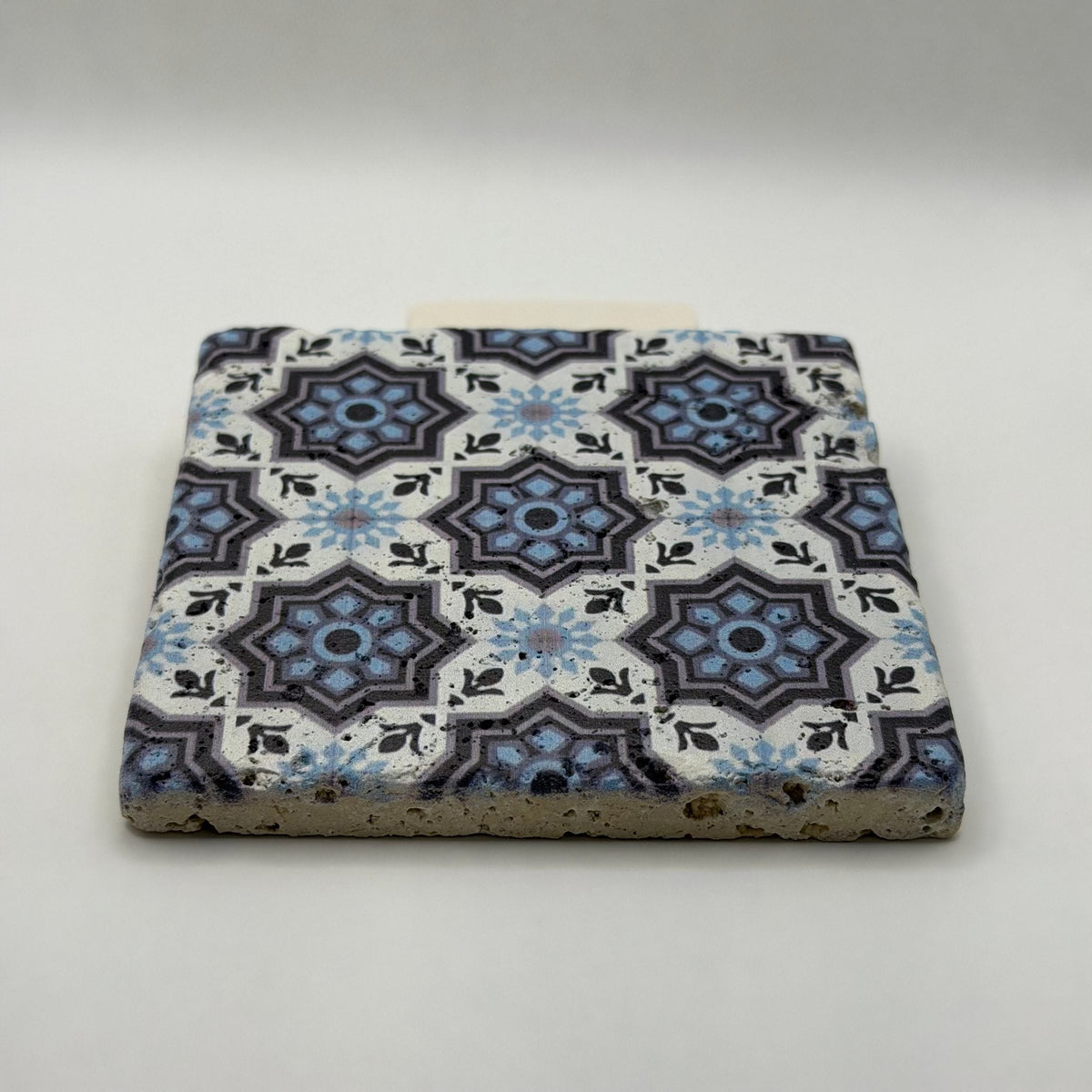 Ethnics pattern number 15 printed on a natural travertine stone coaster