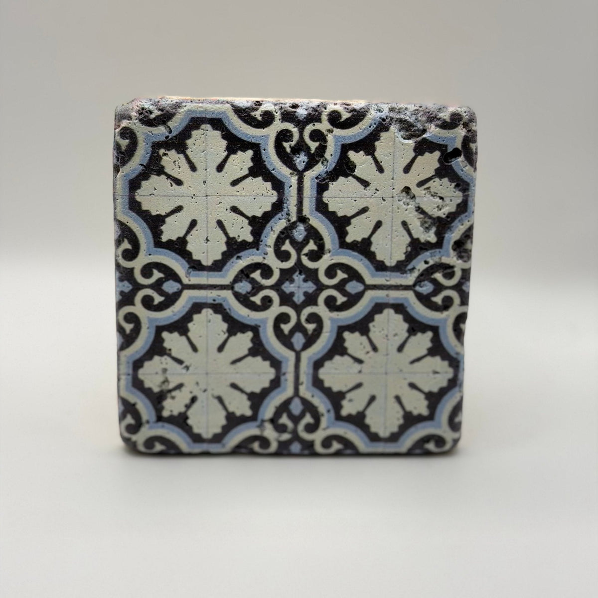 Ethnics pattern number 16 printed on a natural travertine stone coaster