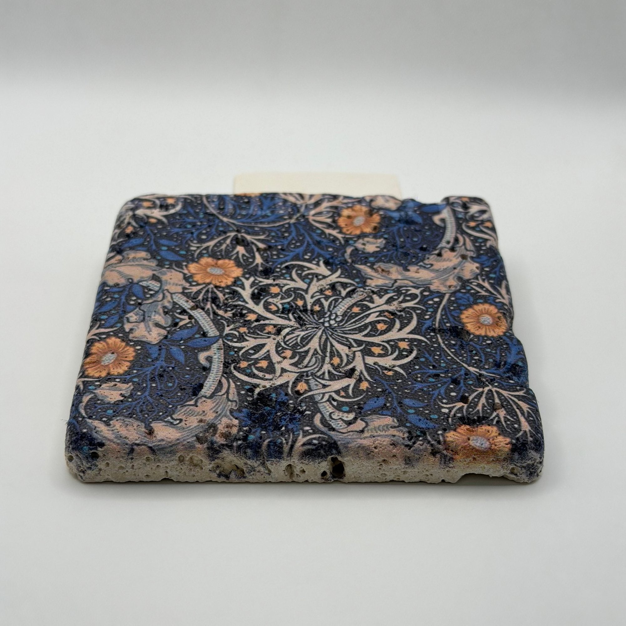 Ethnics pattern number 17 printed on a natural travertine stone coaster
