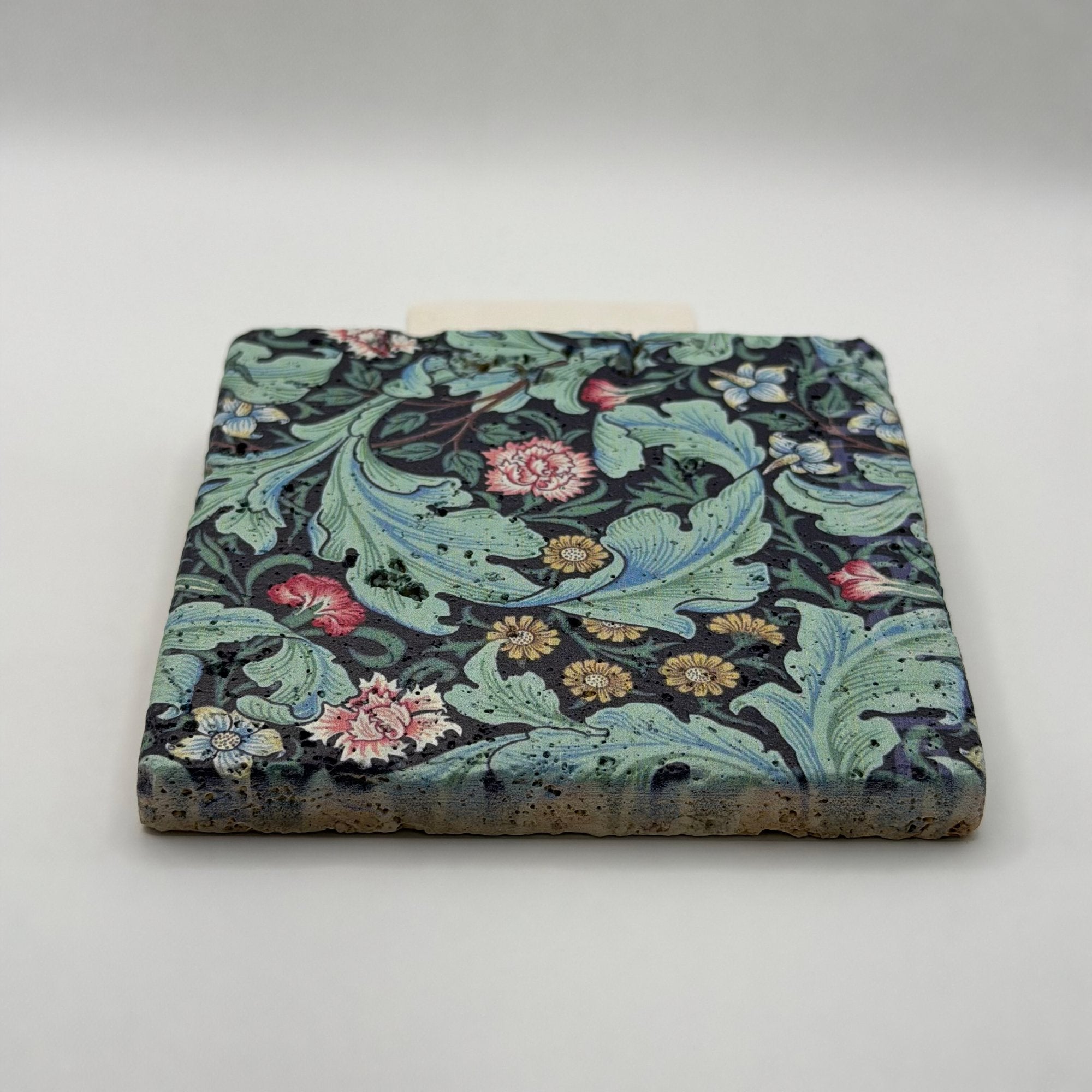 Ethnics pattern number 18 printed on a natural travertine stone coaster