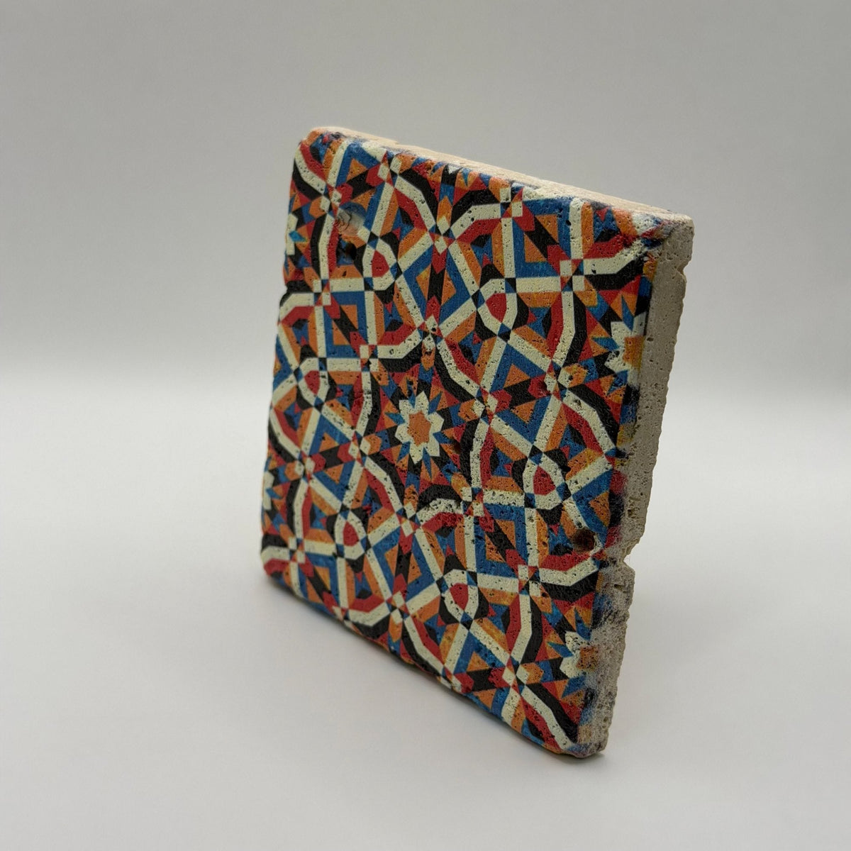 Ethnics pattern number 20 printed on a natural travertine stone coaster