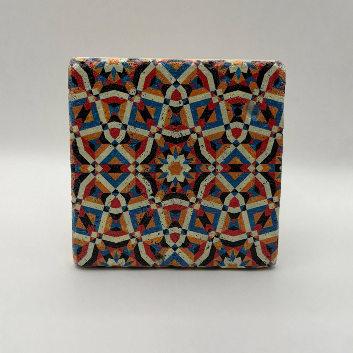 Ethnics pattern number 20 printed on a natural travertine stone coaster