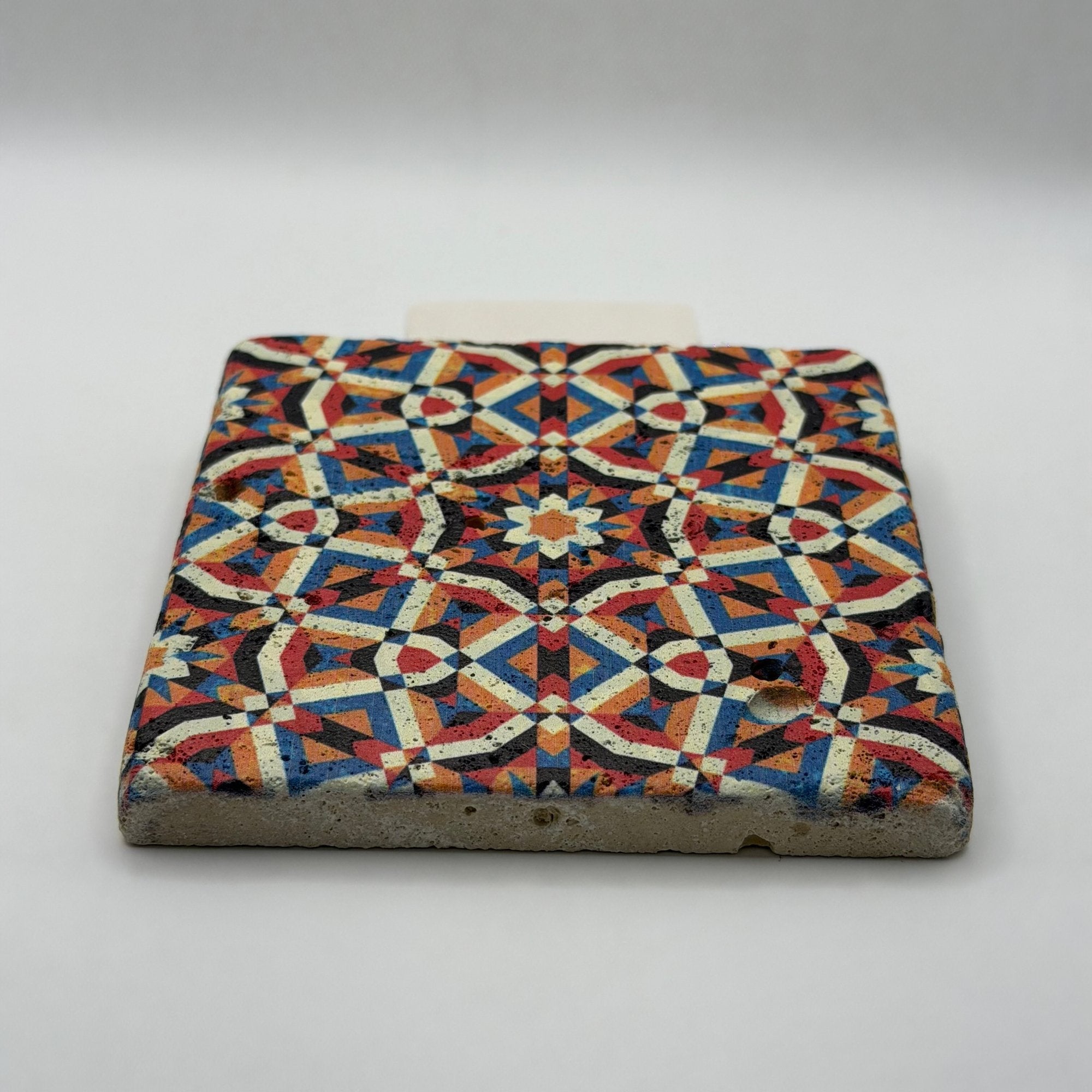 Ethnics pattern number 20 printed on a natural travertine stone coaster