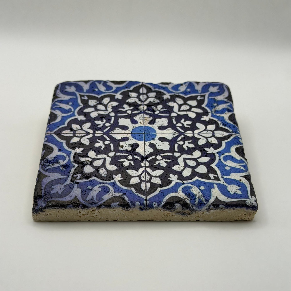Ethnics pattern number 21 printed on a natural travertine stone coaster