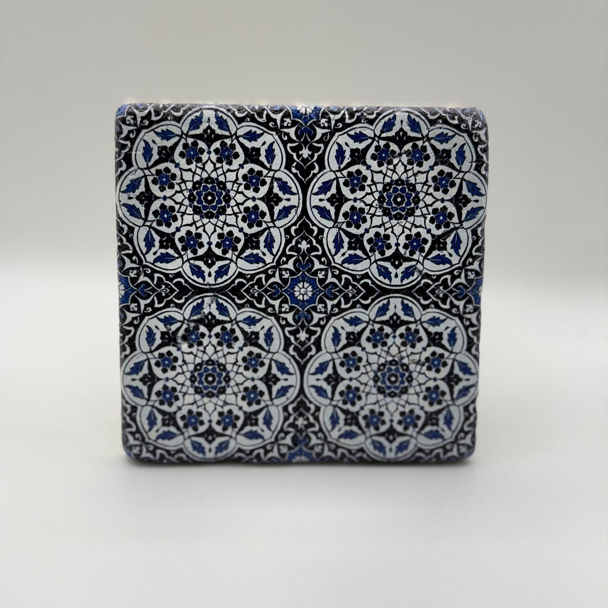Ethnics pattern number 29 printed on a natural travertine stone coaster