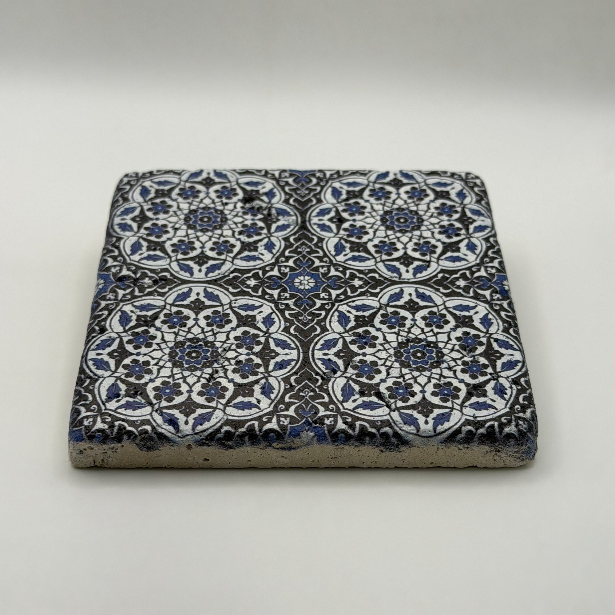 Ethnics pattern number 29 printed on a natural travertine stone coaster
