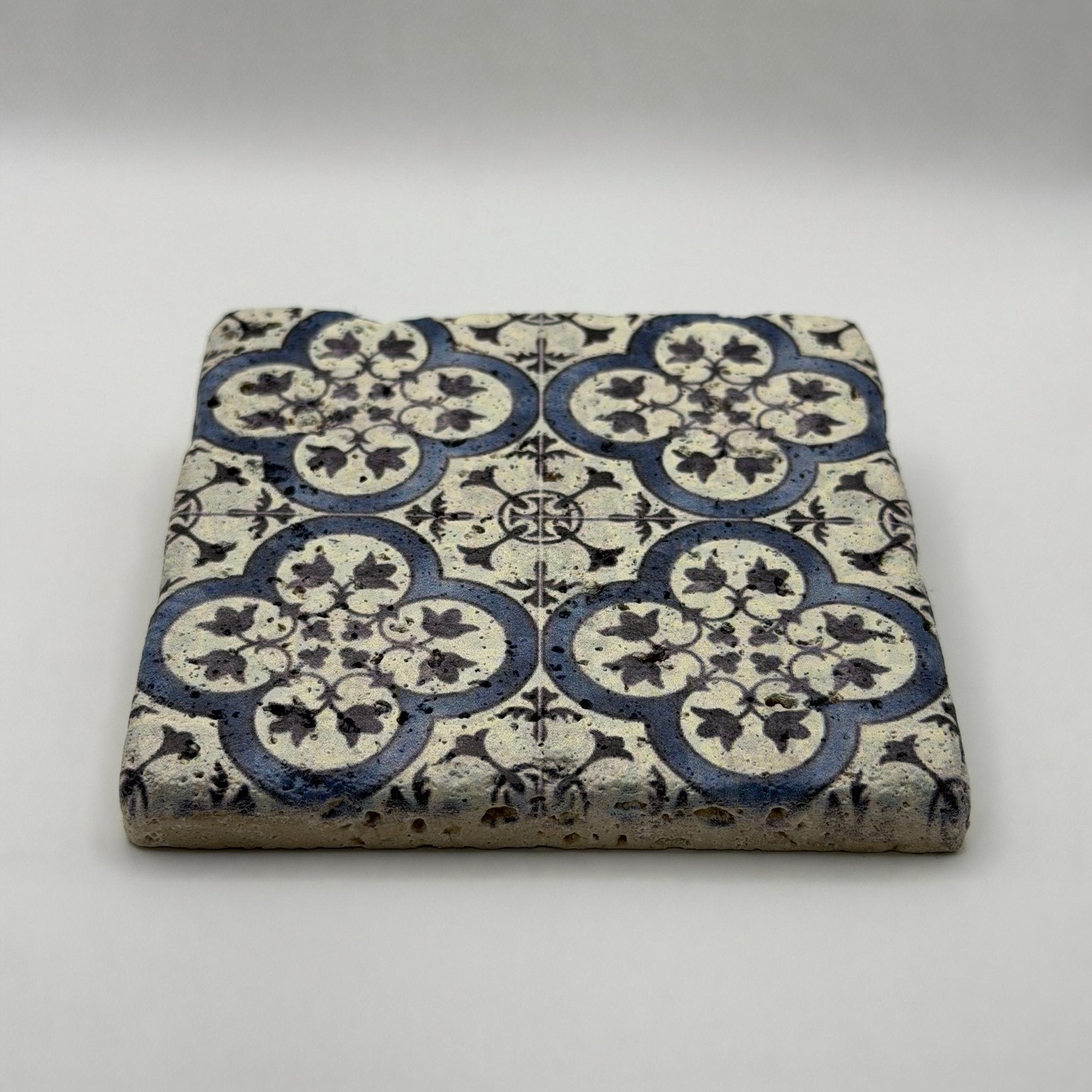 Ethnics pattern number 31 printed on a natural travertine stone coaster