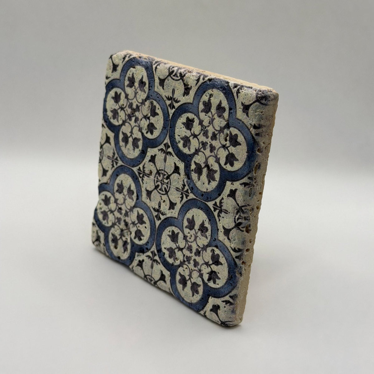 Ethnics pattern number 31 printed on a natural travertine stone coaster