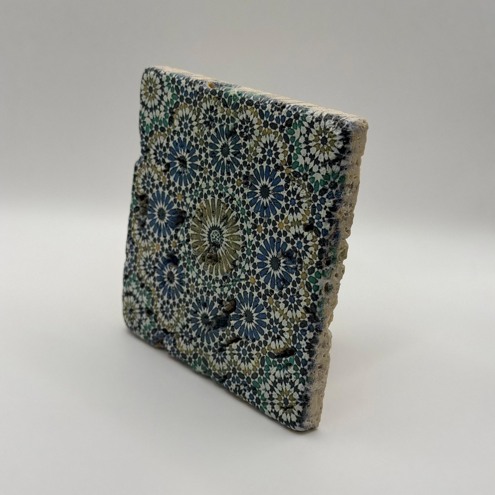 Ethnics pattern number 33 printed on a natural travertine stone coaster