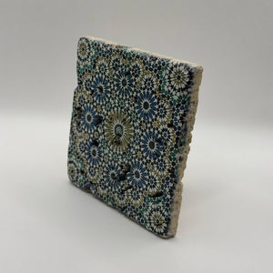 Ethnics pattern number 33 printed on a natural travertine stone coaster