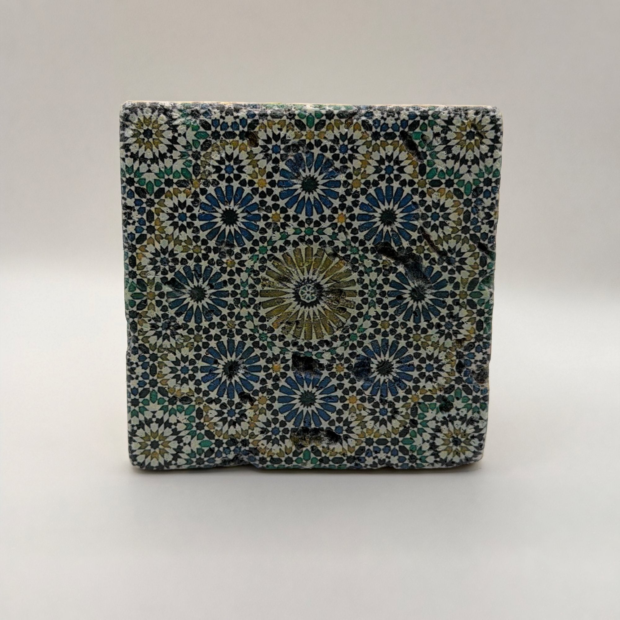 Ethnics pattern number 33 printed on a natural travertine stone coaster